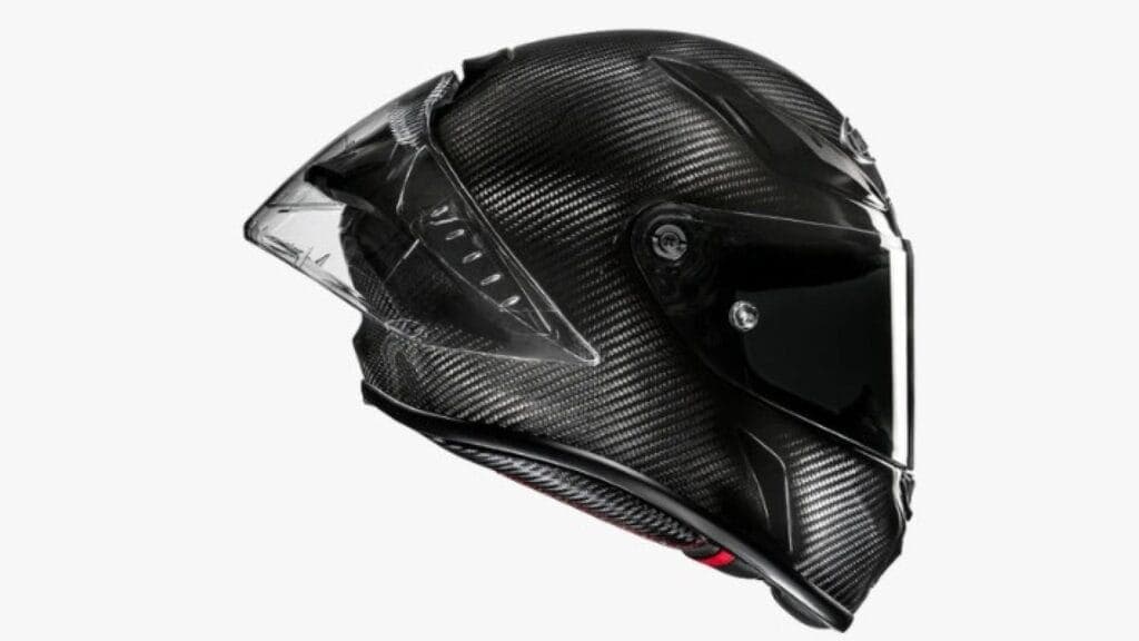 High-performance black carbon fiber motorcycle helmet with aerodynamic design.