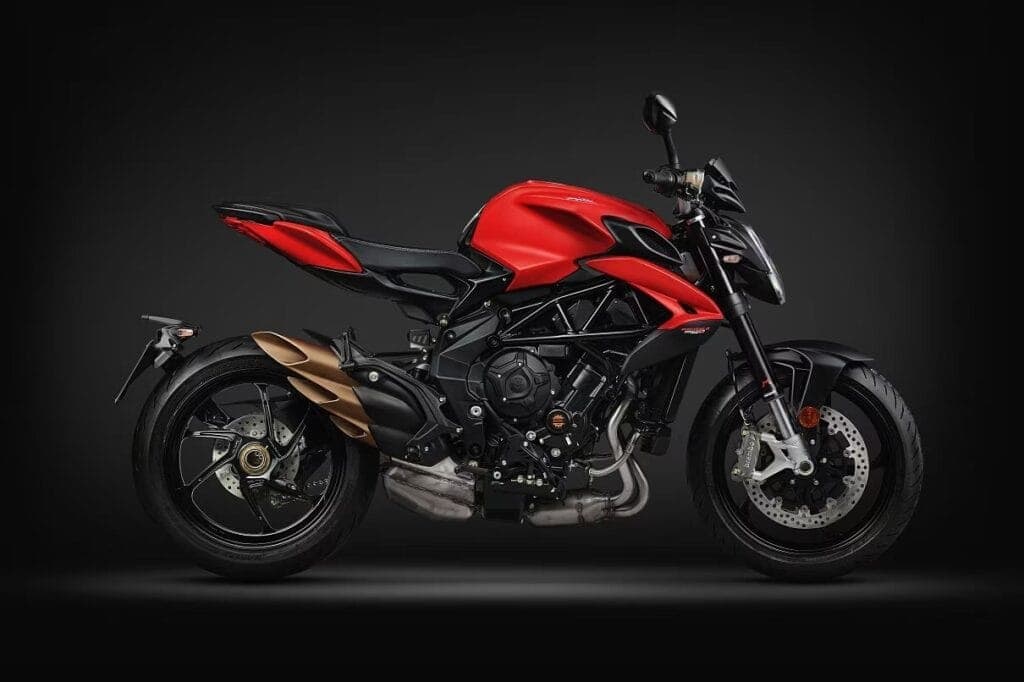 Red sport motorcycle with black accents on a dark background.
